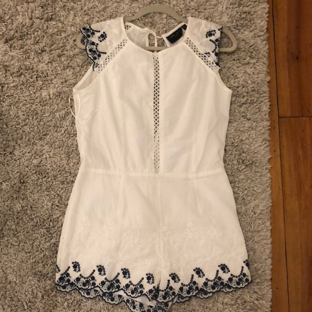 White romper with Blue embroidery